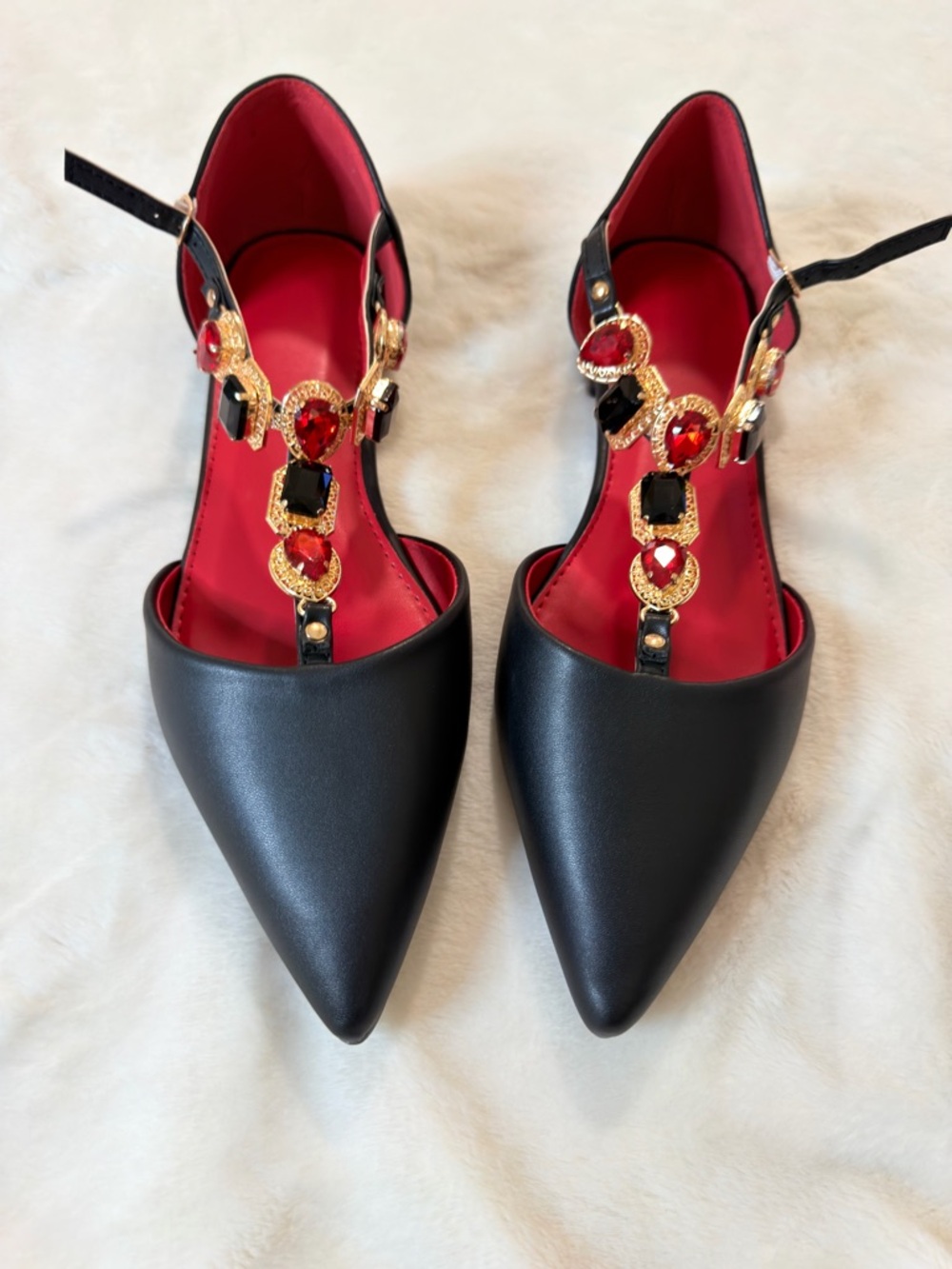 Black Pointed Toe T-Strap Flats with Red Jewel Accents